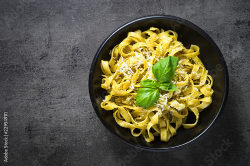 Tagliatelle pasta with pesto sauce and parmesan.