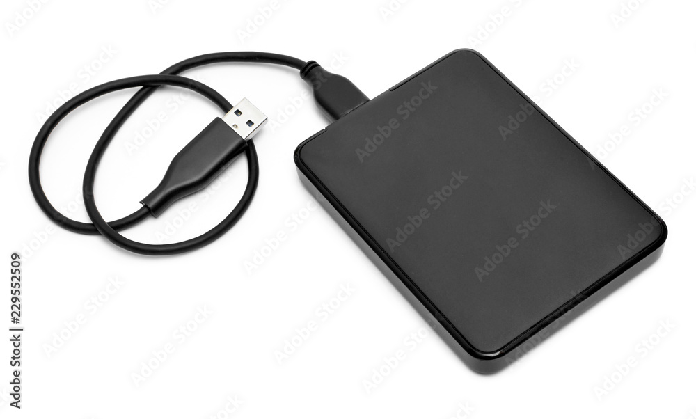 External hard disk with cable, isolated on white background. Small modern hard drive, PC security. External hard disk with cable, isolated on white background. Small modern hard drive, PC security.