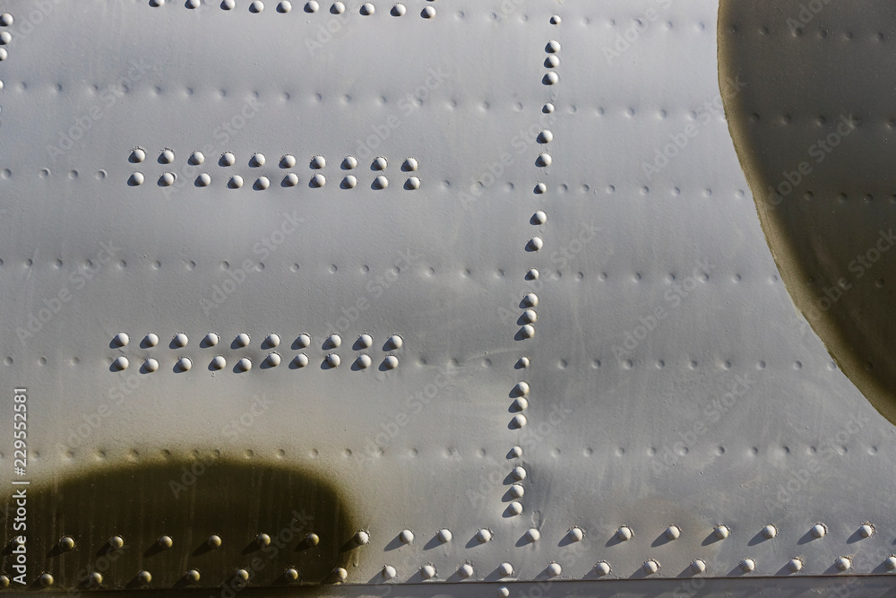 The texture of the metal of military equipment close-up shot. 