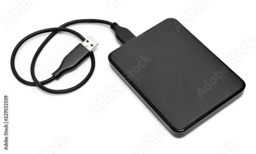 External hard disk with cable  isolated on white background. Small modern hard drive  PC security.