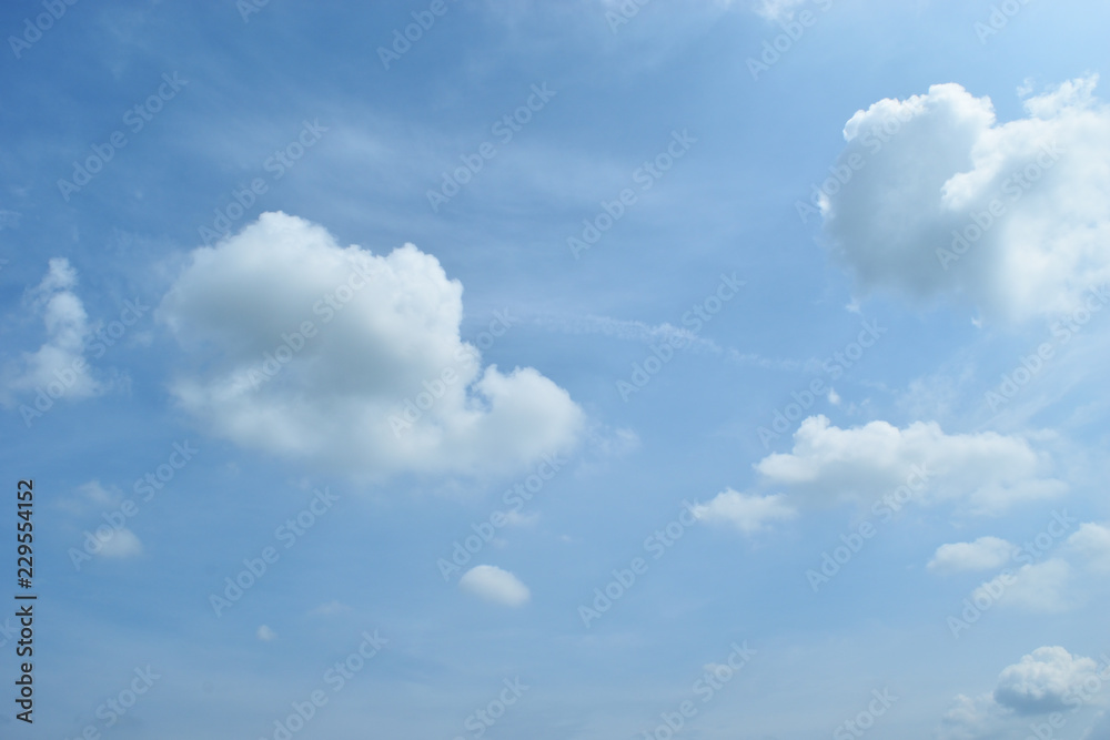 Cumulus cloud on beautiful blue sky , Fluffy clouds formations at tropical zone , Thailand
