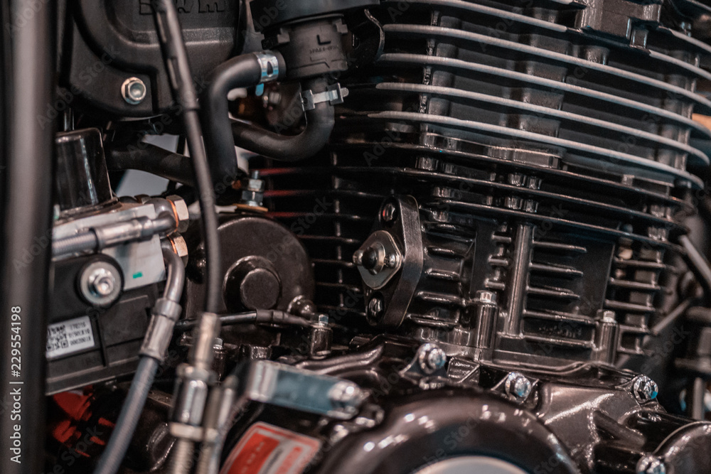 Fototapeta premium Engine design details, radiator from customized motobike in Italy, Rome. Black parts, chrome pipings.