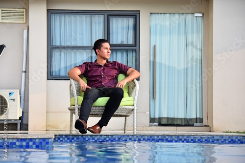 Serious Handsome Person At Apartment photo