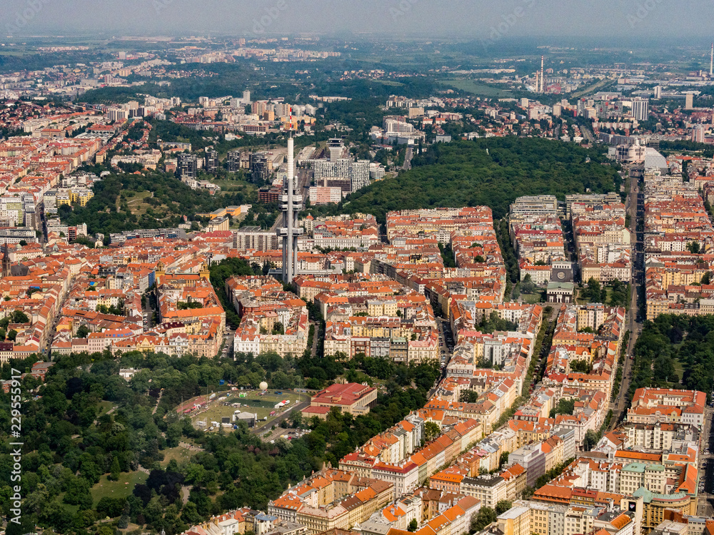 Aerial view of the city center and the Zizkov tower in Prague 3, Czech Republic. Panoramic view from airplane. Czech Republic