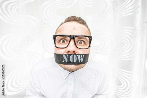 A frightened and surprised man has to do things right now and he does not have time for it. He says he does not have time. Do it now, stop time concept.