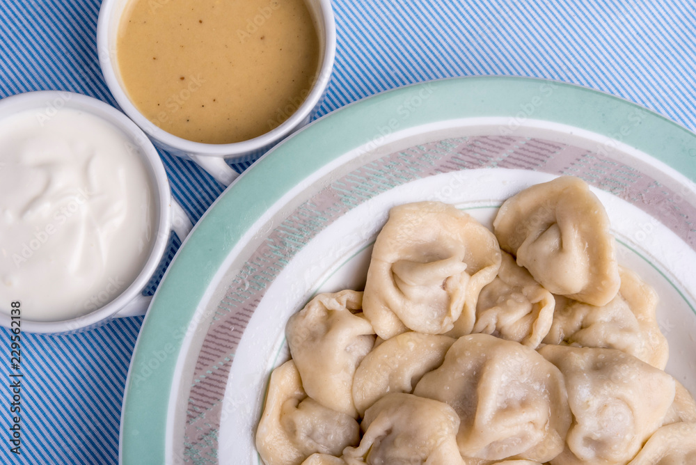 russian traditional meal - pelmeni, homemade meat dumplings, on plate