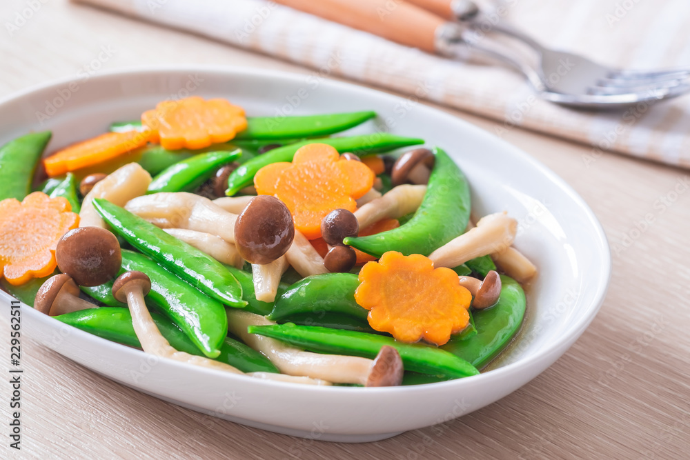 Stir fried mixed vegetables on plate, Vegetarian food Stir fried mixed vegetables on plate, Vegetarian food