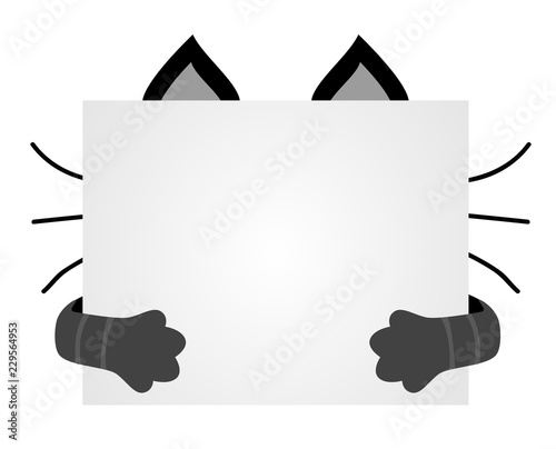 Muzzle cats hid for a piece of paper. Empty space for text on the poster. The ears and paws of a cat.