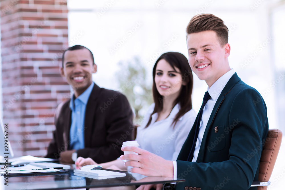 portrait of a professional business team sitting at Desk portrait of a professional business team sitting at Desk