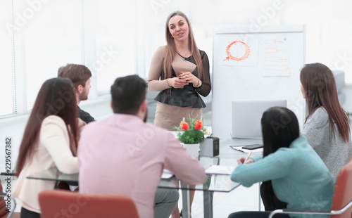 business woman holds a briefing for the business team