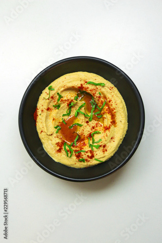 Homemade hummus with olive oil and paprika