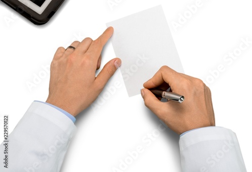 Close-up of Doctor Writing on a Prescriprion photo