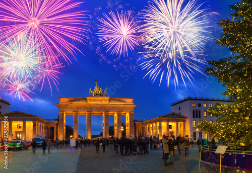 Bradenburg Gate with Christmas tree at night with fireworks, Berlin Germany