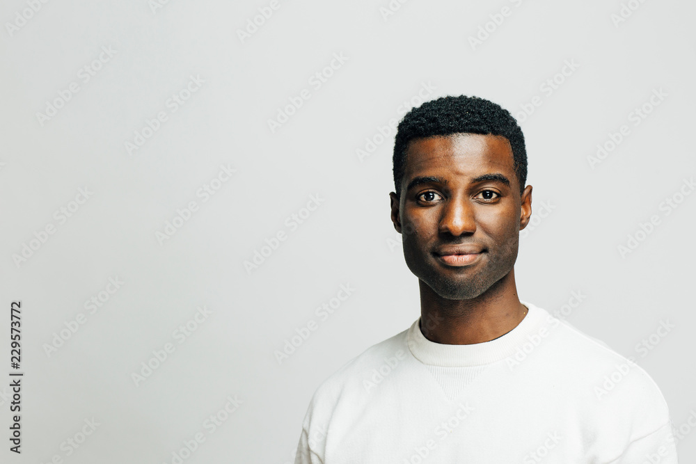 Portrait of a nice young man looking at camera, isolated on white studio background Portrait of a nice young man looking at camera, isolated on white studio background