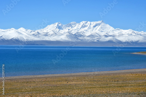 Tibet, lake Nam-Tso (Nam Tso) and Nyechen Tangla mountain in sunny day