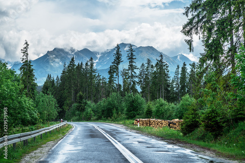 Fototapeta Naklejka Na Ścianę i Meble -  Road and High Tatras tops covered with heavy white clouds.