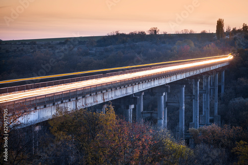 car trails on the bridge in twilight time