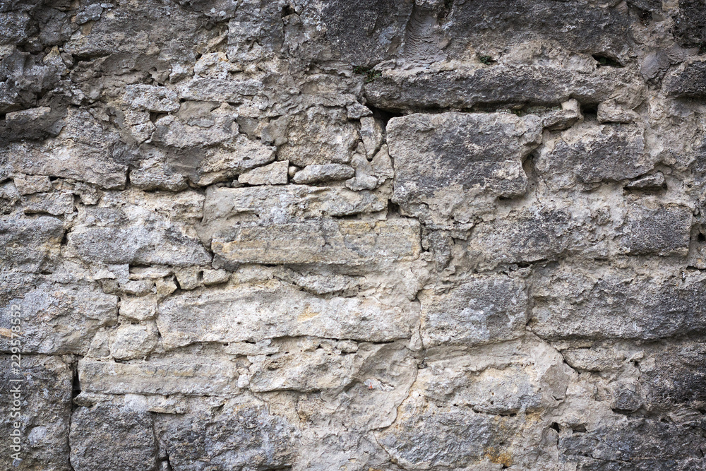 Beautiful texture of a gray stone wall. Backgrounds Beautiful texture of a gray stone wall. Backgrounds