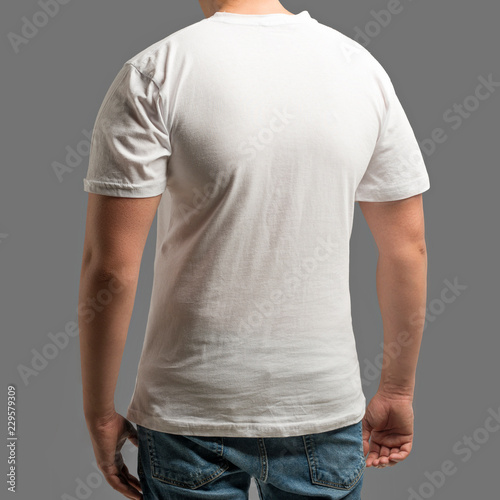 Man wearing a white cotton shirt with empty space for your text or logo isolated on gray background
