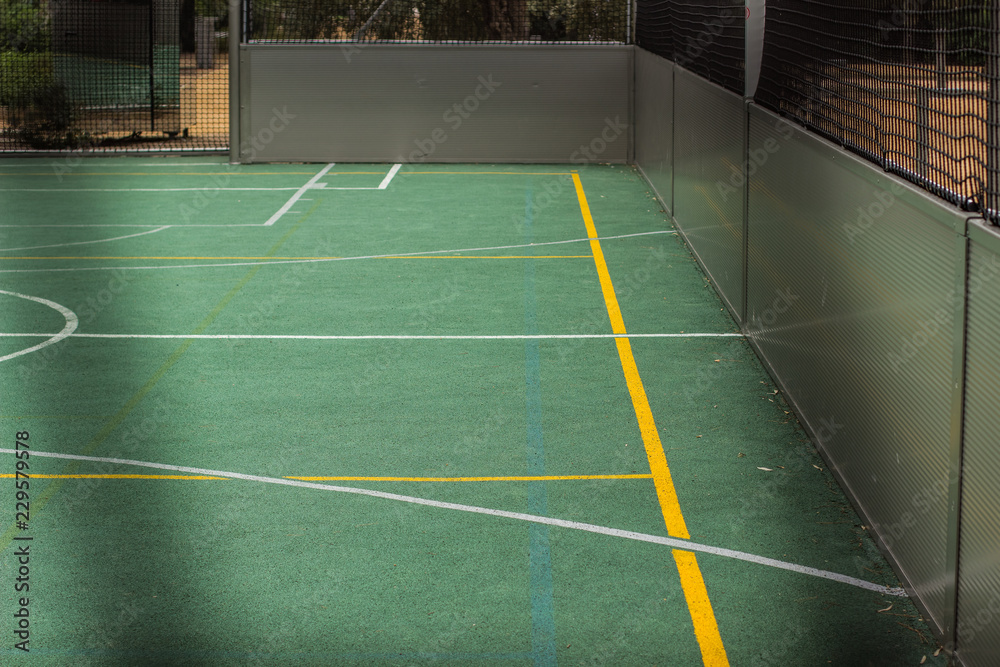 Fototapeta premium accomplishment design concept of football and basketball field place for game with green athletic ground surface and marking