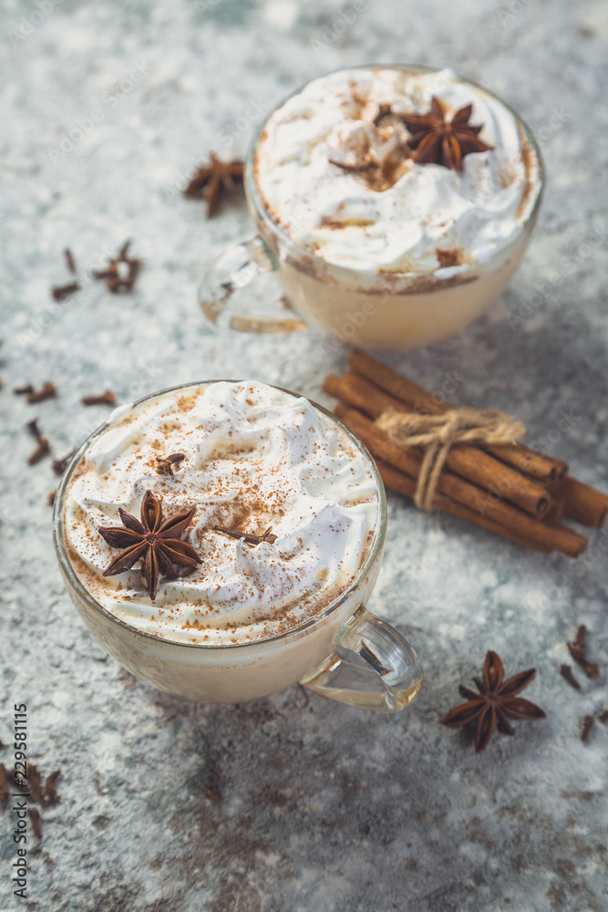 Chai latte and ingredients on concrete background, toned