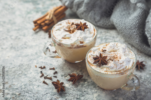 Fotografia Chai latte and ingredients on concrete background, toned