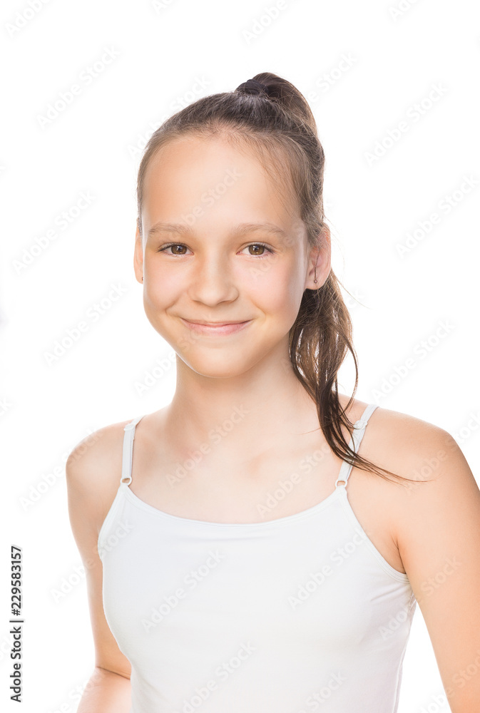Beautiful smiling caucasian preteen girl in tank top with ponytail isolated on white. Studio portrait Beautiful smiling caucasian preteen girl in tank top with ponytail isolated on white. Studio portrait