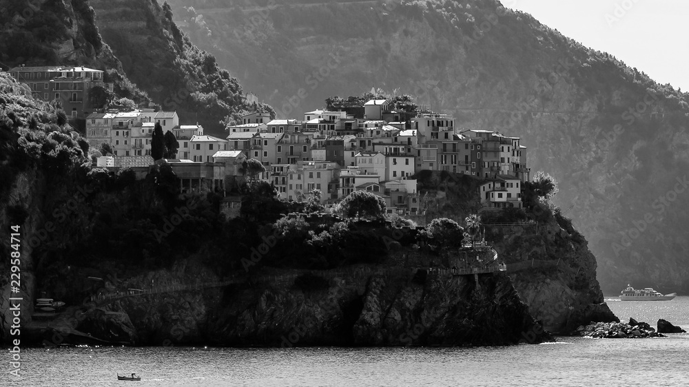 The village of Manarola seen from Corniglia in black and white, Cinque Terre, Liguria, Italy