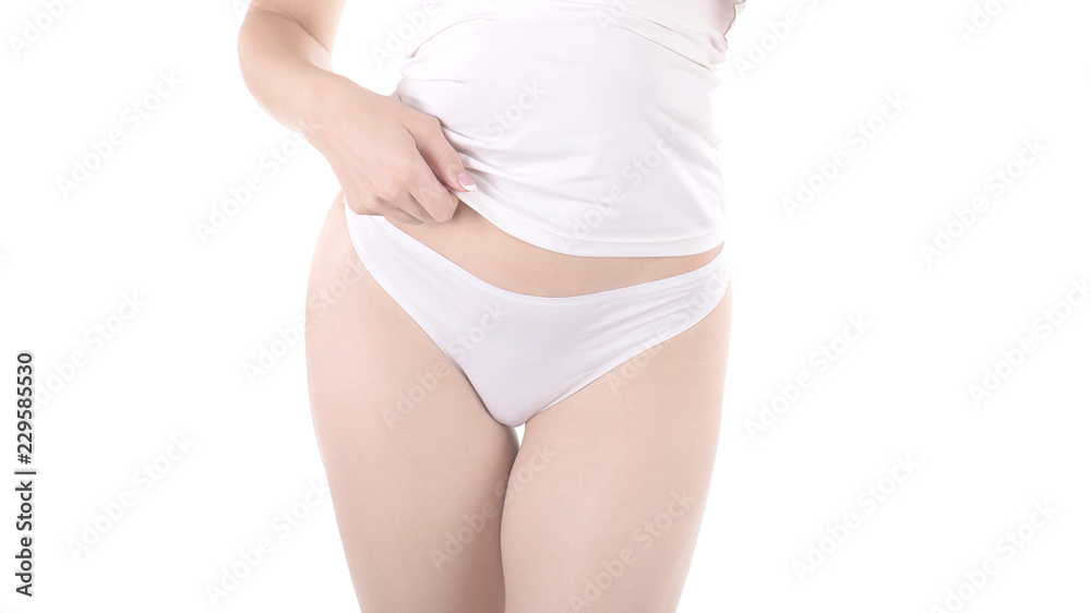 Female cropped hips in white panties and tank top, isolated on white.