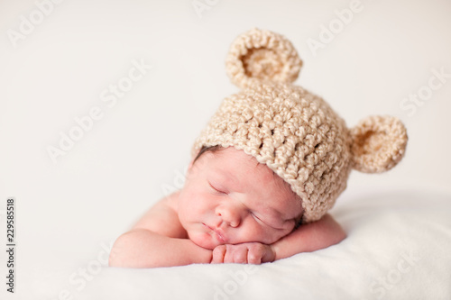 Newborn Baby in Knit Bear Hat, Sound Asleep