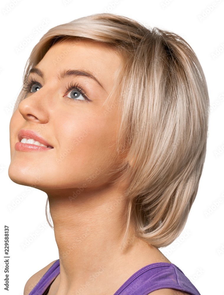 smiling young woman looking up portrait smiling young woman looking up portrait