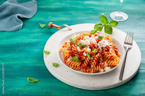 healthy fusilli pasta with tomato sauce parmesan basil photo