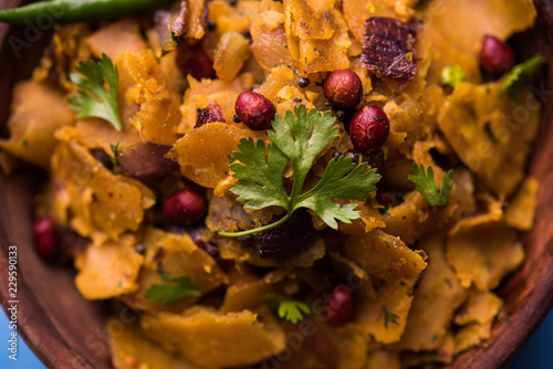 Homemade Kothu Parotta/ Paratha or Stir Fried Leftover Chapati Masala or  fodnichi poli in marathi, served in a bowl or plate with curd and hot tea. Selective focus photo