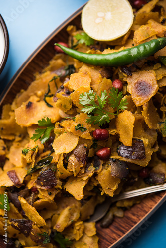 Homemade Kothu Parotta/ Paratha or Stir Fried Leftover Chapati Masala or  fodnichi poli in marathi, served in a bowl or plate with curd and hot tea. Selective focus photo