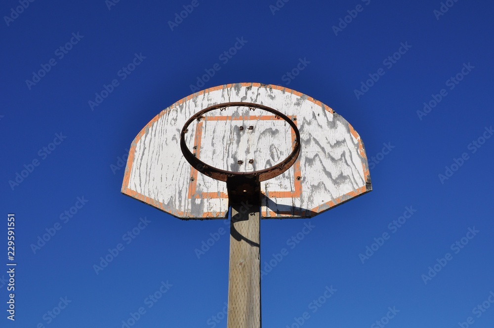 Basketball ring without net and board in blue sky Basketball ring without net and board in blue sky