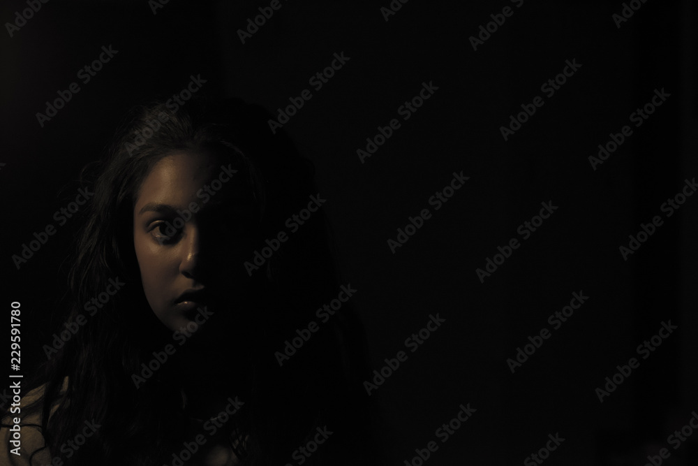 portrait of a young woman in dark