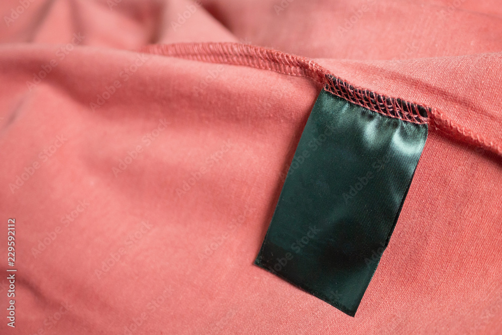 blank black color clothing label on red t shirt