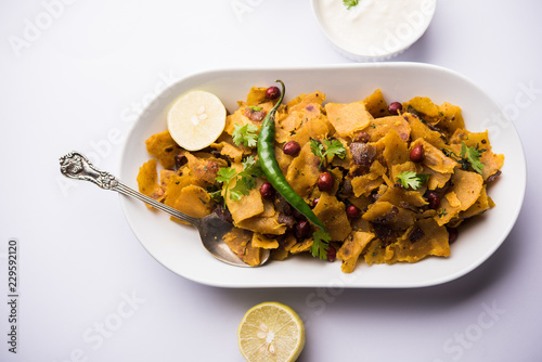 Homemade Kothu Parotta/ Paratha or Stir Fried Leftover Chapati Masala or  fodnichi poli in marathi, served in a bowl or plate with curd and hot tea. Selective focus photo