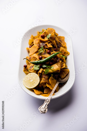 Homemade Kothu Parotta/ Paratha or Stir Fried Leftover Chapati Masala or  fodnichi poli in marathi, served in a bowl or plate with curd and hot tea. Selective focus photo