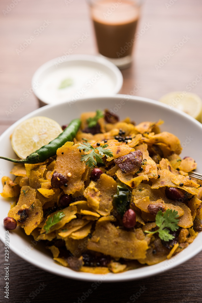 Homemade Kothu Parotta/ Paratha or Stir Fried Leftover Chapati Masala or fodnichi poli in marathi, served in a bowl or plate with curd and hot tea. Selective focus Homemade Kothu Parotta/ Paratha or Stir Fried Leftover Chapati Masala or fodnichi poli in marathi, served in a bowl or plate with curd and hot tea. Selective focus