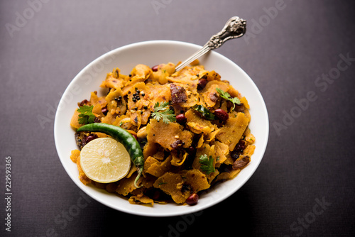 Homemade Kothu Parotta/ Paratha or Stir Fried Leftover Chapati Masala or  fodnichi poli in marathi, served in a bowl or plate with curd and hot tea. Selective focus photo