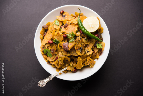 Homemade Kothu Parotta/ Paratha or Stir Fried Leftover Chapati Masala or  fodnichi poli in marathi, served in a bowl or plate with curd and hot tea. Selective focus photo