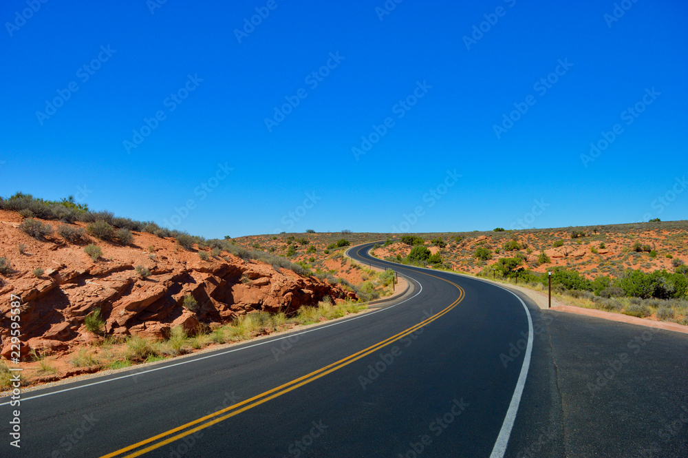 Empty road and curves in Arches national park Empty road and curves in Arches national park
