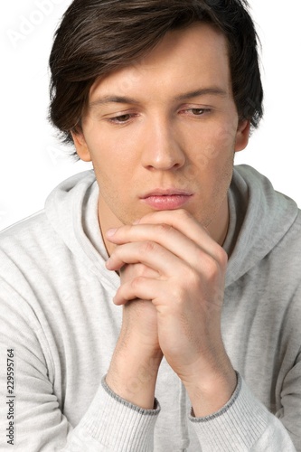 Portrait of young thoughtful man, isolated