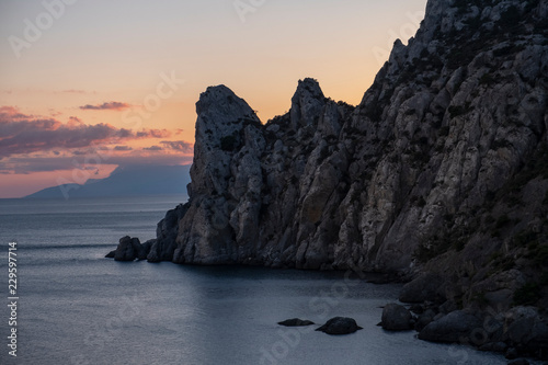 mountain landscape of rocky coast with sea Bay at dawn sunset. Crimea Russia