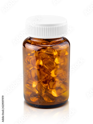 Fish oil dietary supplement capsules in brown glass bottle