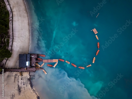 A drone shot of the boats at Lago di Braies in Dolomites - yes you can rent them