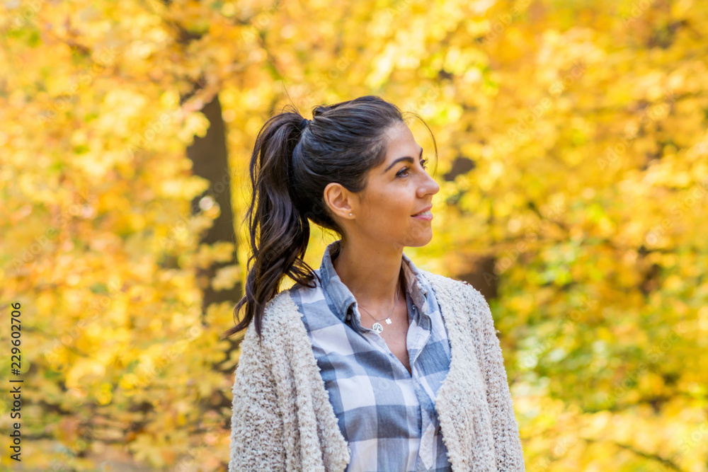 Beautiful Young Happy Woman in Autumn Park with Yellow Trees.Autumn Season Time Beautiful Young Happy Woman in Autumn Park with Yellow Trees.Autumn Season Time