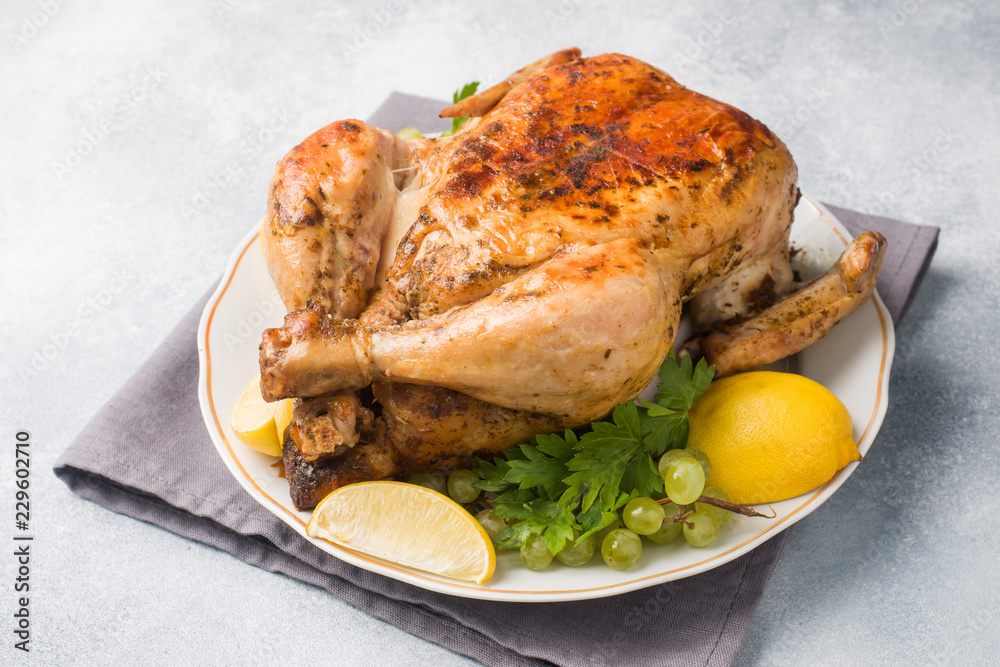 Baked chicken for dinner on the festive table. Copy space Baked chicken for dinner on the festive table. Copy space