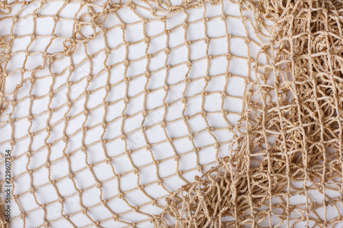 Fishnet on white background. Fishing net. Texture fishnet, seine. Dragnet, drag, trammel, sweep-net